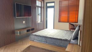 Postel nebo postele na pokoji v ubytování Twin Villa Đà Lạt