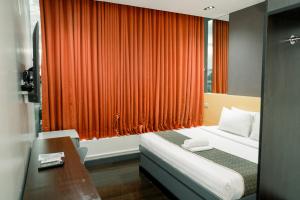 Ένα ή περισσότερα κρεβάτια σε δωμάτιο στο Greenwindows Hotel