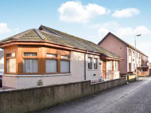 a house on the side of a street at Rycon in Turriff