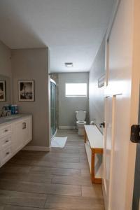 a bathroom with a toilet and a sink at Indy 4-Bedroom Haven: Your Perfect Retreat in Indianapolis