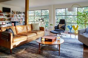 a living room with a couch and a table at Mine and Farm, The Inn at Guerneville, CA in Guerneville