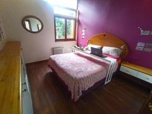 a bedroom with a bed with a laptop on it at Hermosa casa en barrio parque. in Mar del Plata
