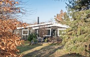 an old house in the middle of the forest at Lovely Home In Jgerspris With Wifi in Jægerspris