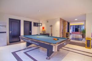 a pool table in the middle of a room at Orestay Garden Hạ Long in Ha Long