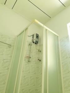 a shower stall in a bathroom with a shower at Mohotti House in Galle