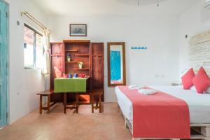 Postel nebo postele na pokoji v ubytování Casa Toloc Tulum