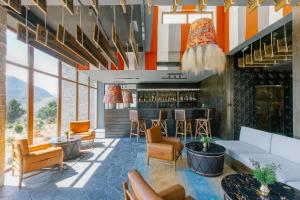 a lobby with couches and a bar in a building at Shinta Mani Mustang in Jomsom