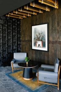 a living room with a table and two chairs at Shinta Mani Mustang in Jomsom
