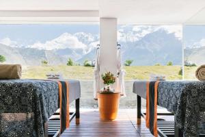 a room with two beds and a view of mountains at Shinta Mani Mustang in Jomsom