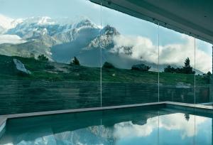 a swimming pool with a view of a mountain at Shinta Mani Mustang in Jomsom
