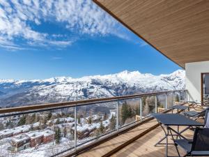 a balcony with a view of snow covered mountains at Appartement Les Arcs 1600, 5 pièces, 12 personnes - FR-1-461A-15 in Arc 1600