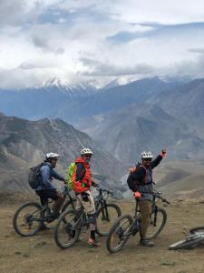 a group of three people on bikes on a mountain at Shinta Mani Mustang in Jomsom
