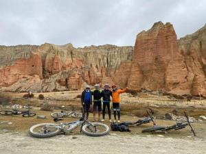 a group of three men standing next to their bikes at Shinta Mani Mustang in Jomsom