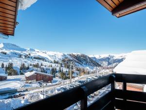 a view from the balcony of a ski resort in the snow at Appartement La Plagne-Tarentaise, 1 pièce, 4 personnes - FR-1-351-131 in La Plagne Tarentaise