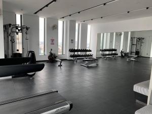 a gym with rows of exercise equipment in a room at Biggest Room 45$ Down 33$/N in Central with Swimming Pool & Gyms. in Phnom Penh