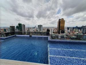 a large swimming pool on the roof of a building at Biggest Room 45$ Down 33$/N in Central with Swimming Pool & Gyms. in Phnom Penh