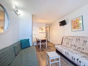 a living room with a couch and a table at Studio cosy à Val-d'Isère, 4 pers, balcon, cuisine équipée - FR-1-518-157 in Val dʼIsère