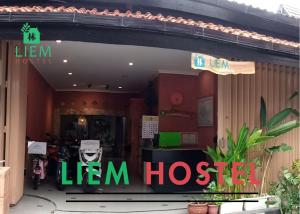a sign in front of a lien hoset restaurant at Liem Hostel Malioboro in Yogyakarta
