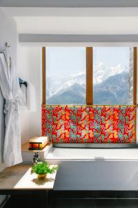 a bathroom with a window with a view of mountains at Shinta Mani Mustang in Jomsom