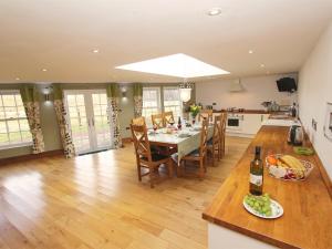 a kitchen and dining room with a table and chairs at 3 Bed in Northumberland National Park CN043 in Alwinton