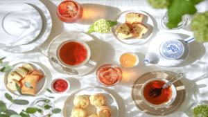 a table with plates of food and a cup of tea at New Osaka Hotel Shinsaibashi in Osaka