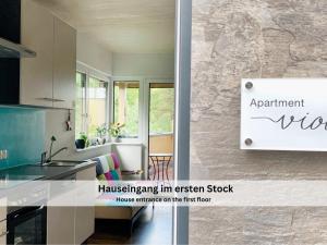 an image of a kitchen with a sign for at Apartments Viola Altenmarkt in Altenmarkt im Pongau