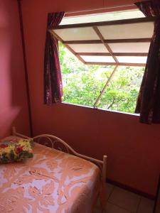 Tempat tidur dalam kamar di Fare OKAI