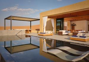 a villa with a pool in the desert at The Ritz-Carlton Ras Al Khaimah, Al Wadi Desert in Ras al Khaimah
