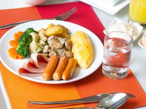 a white plate of food on a table at ibis Bangkok Sathorn in Bangkok