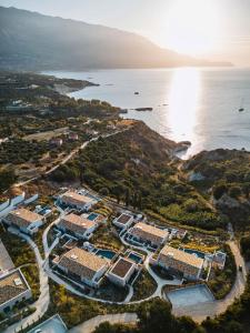 an aerial view of a resort next to the ocean at Eliamos Villas Hotel & Spa in Spartia