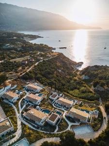 an aerial view of a resort next to the ocean at Eliamos Villas Hotel & Spa in Spartià