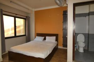 Postel nebo postele na pokoji v ubytování Paradise Guest House