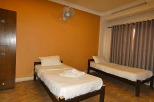 Postel nebo postele na pokoji v ubytování Paradise Guest House