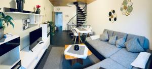 a living room with a couch and a table at Ferienwohnung Alte Schule in Winterberg