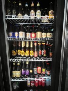 a refrigerator filled with lots of bottles of beer at LuckyTito Dmall Boracay in Boracay