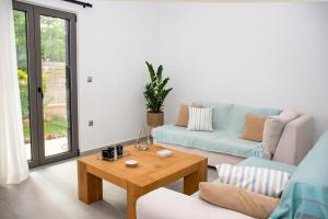 A seating area at Christina Apartment