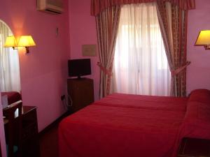 Postel nebo postele na pokoji v ubytování Hostal Centro Sol Madrid