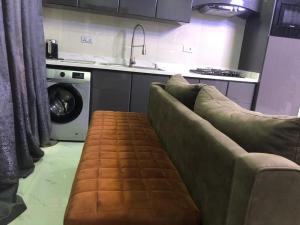 Kuchyň nebo kuchyňský kout v ubytování Properties by AlphaOne