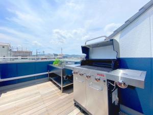 a grill on the deck of a balcony at YS Building 3F - Vacation STAY 31281v in Kakegawa