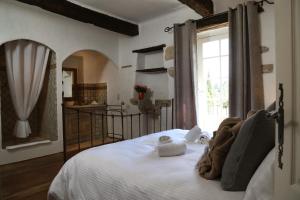 a bedroom with a bed with towels on it at Château de Villarlong in Villarzel-Cabardès +206 photos