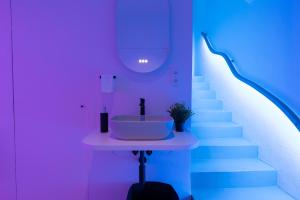 a bathroom with a sink and a staircase at SPA SPA Legerova in Prague
