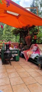 an outdoor market with beds and a tent at Dom wakacyjny in Nadkole