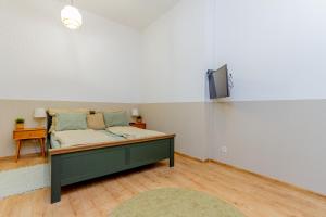 מיטה או מיטות בחדר ב-RothApartments'GARDEN