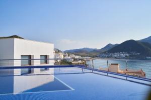 a swimming pool with a view of a body of water at Casa Marc in San José