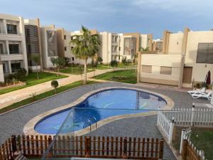 Bazén v ubytování Appartement de LUXE Marina SAIDIA avec vue sur PISCINE Résidence TAMARIS nebo v jeho okolí