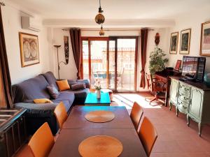 a living room with a couch and a table at Apartamento Montesol in Sanet y Negrals