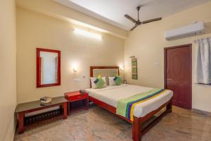 Ένα ή περισσότερα κρεβάτια σε δωμάτιο στο Treebo Grace Inn, 3 Min Walk From Promenade Beach