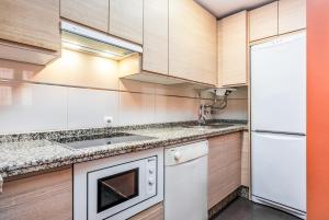 Kuchyň nebo kuchyňský kout v ubytování Smartr Sevilla Las Dueñas