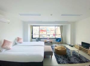 A bed or beds in a room at THE MOON Atami