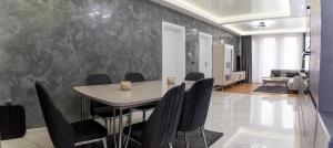 a dining room with a table and chairs at A-Dent luxury apartments & Dental Clinic in Gotse Delchev